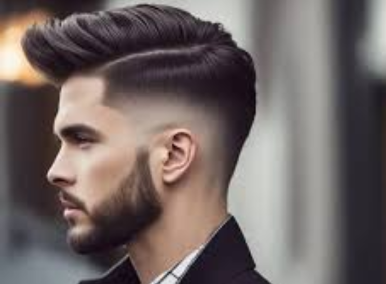 A taper fade is characterized by a gradual transition from longer hair on top to shorter hair on the sides and back